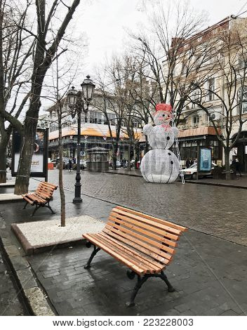 Odessa, Ukraine - December 28, 2017: People visit Deribasovskaya Street. Deribasovskaya is the central street of Odessa and one of the main attractions of the city.