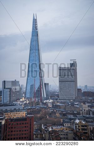 The Shard skyscraper with grey clouds in the sky