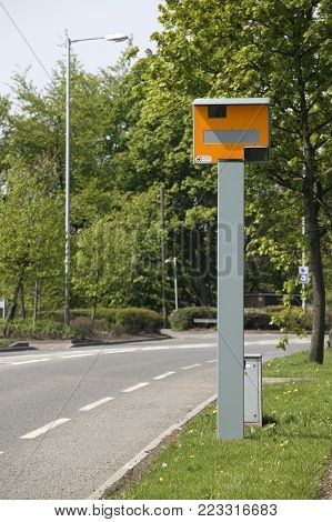 WEST YORKSHIRE, UK: YELLOW GATSO ROAD TRAFFIC SPEED CAMERA ON DESERTED ROAD, 8TH MAY, 2004, WEST YORKSHIRE, UK