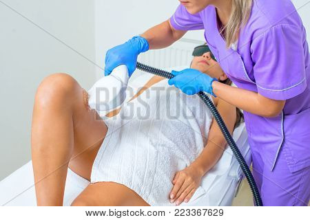 Young Beautiful Woman Gets Professional Body Shape Treatment In A Beauty Clinic