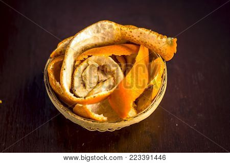 Fresh Peel Of Oranges,citrus Reticulata,citrus Aurantium In A Traditional Basket On Wooden Surface.