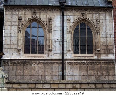 Wawel Royal Castle, architecture of the old town, windows in the Gothic style.