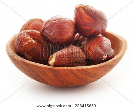 Hazelnut In A Bowl Isolated Over White Background