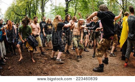 TOLMIN, SLOVENIA - JULY 24TH: HEAVY METAL FANS DOING MOSH PIT ENJOYING IN CONCERT OF THEIR FAVORITE BAND AT METALDAYS FESTIVAL ON JULY 24TH, 2018 IN TOLMIN, SLOVENIA