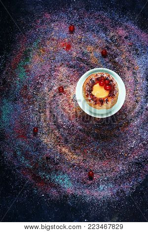 Galaxy. Star Dust. Confectionery product. Multicolored. Sugar and powdered sugar. Abstract background. Sweet food. Kuglof. dessert