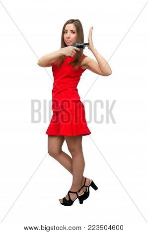 The spy. Special agent girl. Secret service. Dangerous sexy woman in short red dress in stockings and high heels shoes is holding gun in her hands isolated on white.