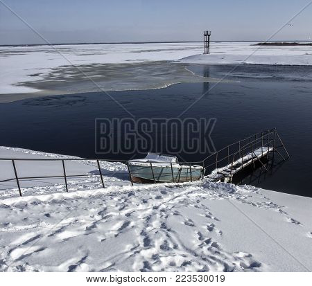 The boat is in the bay at the north pole