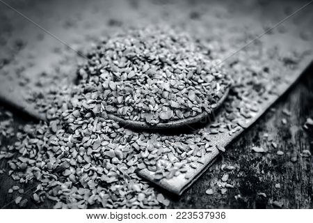Crushed Fenugreek Seeds,trigonella Foenum-graecum Seeds,methi Ke Koriya In A Bowl On Wooden Surface.