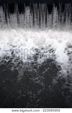 A picture of the flowing water. The dam is designed to regulate the water level in rivers within the city and to provide technical water to industrial objects