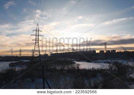 Sunset in the city in the winter in a strong frost
