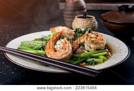 Grilled Slice Pork With Charcoal Flame Set On Rice Bowl In Japanese Style.