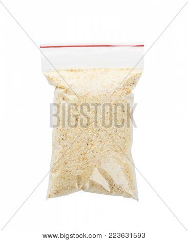 Ziploc bag with dried garlic powder on white background