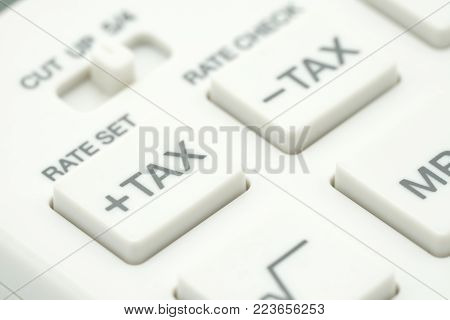 Keypad TAX button For tax calculation. Easy to calculate. on White calculator on white background using as background business concept and Education concept with copy spaces for your text or design.