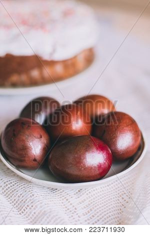 Easter Table With Traditional Easter Cakes And Easter Eggs With Blossoming Tree Branch