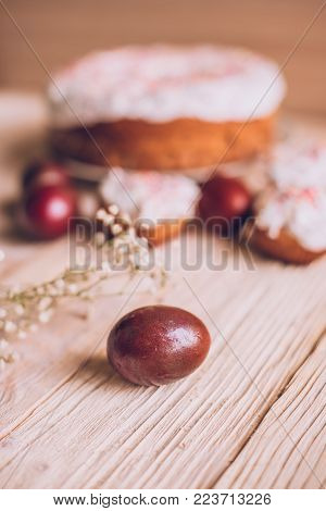 Easter Table With Traditional Easter Cakes And Easter Eggs With Blossoming Tree Branch
