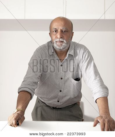 Bearded Asian Man Looking Into Camera Lens