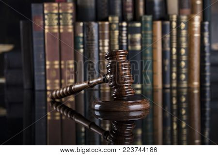 Legal system. Law and justice concept. Gavel of the jugde  in the court library.