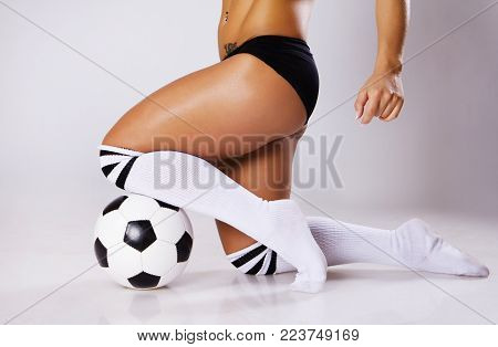 Image of sexy girl posing with ball