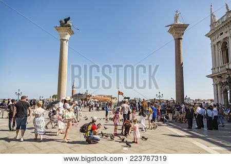VENICE - JULY 1: San Marco square and the columns of San Marco and San Todaro on July 1, 2017 in Venice, Italy