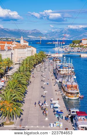 TROGIR, CROATIA - SEPTEMBER 18: Trogir old town UNESCO world heritage site waterfront promenade on a sunny day September 18, 2016 in Trogir