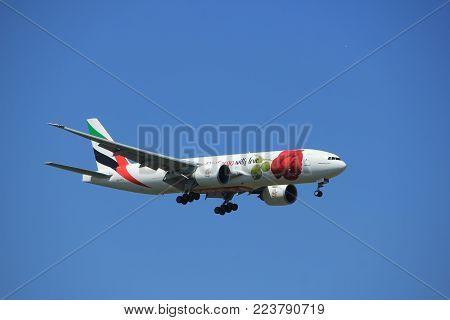 Amsterdam the Netherlands - July 9th 2017: A6-EFL Emirates Boeing 777 approaching Schiphol Amsterdam Airport Kaagbaan runway, Red Rose livery