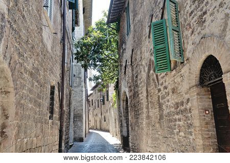 Medieval street in the Italian hill town of Assisi. The traditional italian medieval historic center in Umbria. Italy