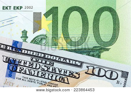 Money: close up of euro and dollar banknotes. High resolution photo.