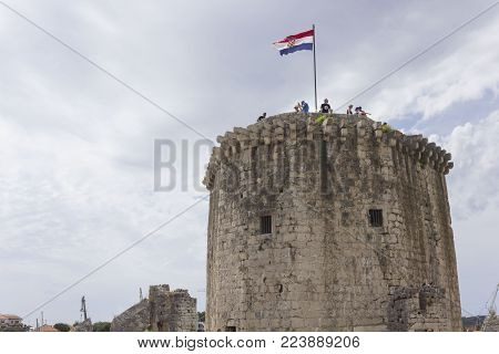 Trogir, Croatia - August 12 2017: Tower Of The Ancient Kamerlengo Castle In Trogir, With People On I