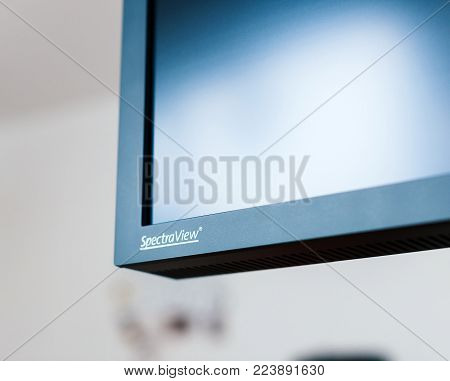 PARIS, FRANCE - JAN 9, 2017: Detail of professional Nec Spectraview Reference 322UHD 4k wide gamut monitor in a photostudio environment