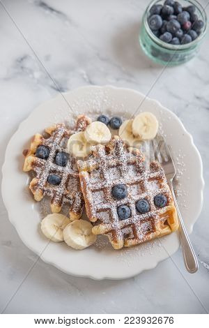 home made sweet waffles with blueberries for breakfast