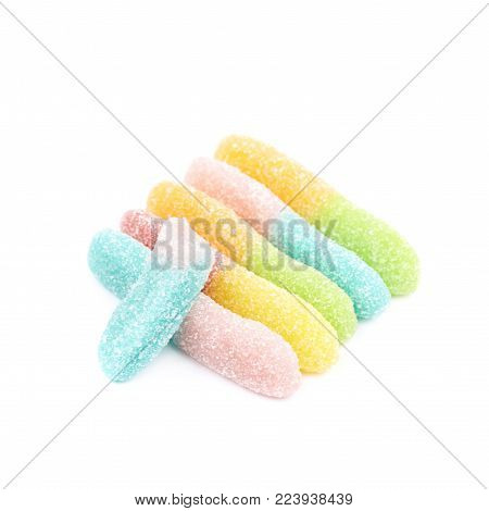 Measured portion of exactly hundred calories of the jelly worm sour sugar candy isolated over the white backgound
