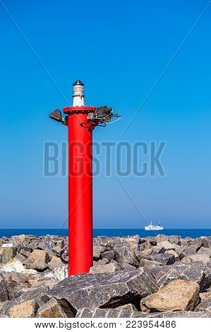 Mole with lighthouse and ship in Kuehlungsborn, Germany.