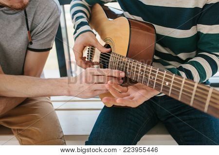 Learning to play the guitar. Music education and extracurricular lessons. Hobbies and enthusiasm for playing guitar and singing songs. To have fun.
