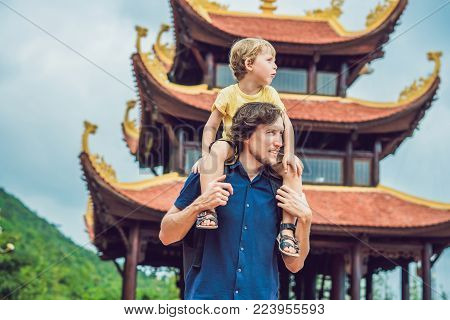 Happy Tourists Dad And Son In Pagoda. Travel To Asia Concept. Traveling With A Baby Concept