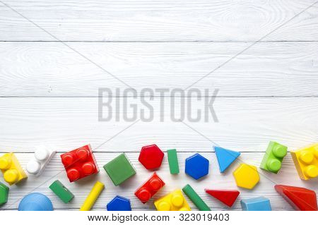 Kids Educational Developing Toys Frame On White Background. Top View. Flat Lay. Copy Space For Text