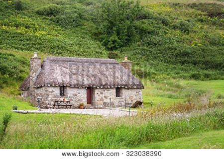 Crofters cottage on the Isle of Skye, Inner Hebrides, Scotland. Image taken from the public highway.
