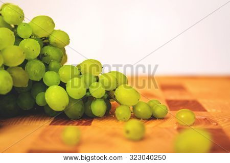 Green Grape On The Wooden Cutting Board