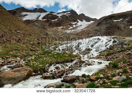 Small River In Martell Valley In South Tyrol (italy) On A Partly Cloudy Day In Summer