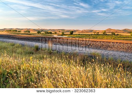 railway tracks along a valley of the Middle Loup River in Nebraska Sandhills, late summer scenery