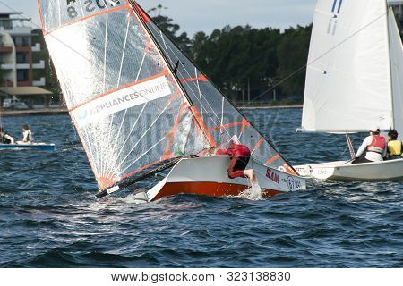 Lake Macquarie, Australia - April 16, 2013: Capsized Competitors Competing In The Australian High Sc