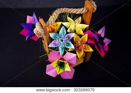 Handmade Colored Paper Flowers Origami Bouquet Paper Craft Art In A Basket With Grass In The Studio 