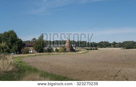 A Round Oast House On A Farm In The Countryside In Kent, Uk