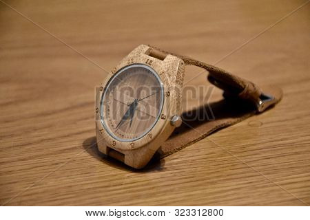 Eco-friendly, Plastic-free And Hand-made Bamboo Watch With Leather Strap From Thailand On A Wooden T