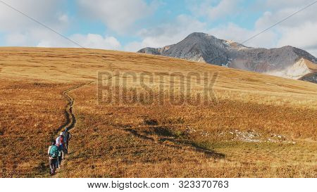 A Route Through Mountain Peaks And Hills Through Majestic Landscapes With Tourists And Travelers In 