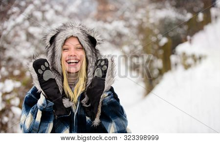 Christmas Girl In Warm Clothing In Winter Park. Cold Winter Weather. Happy Girl Playing Snow Winter 