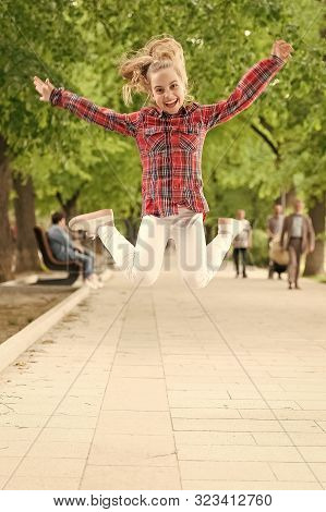 Tireless And Energetic Activity. Small Child Jumping In Casual Fit For Physical Activity. Active Chi