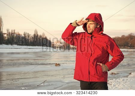 Guy Wear Jacket With Hood On Frosty Winter Day. Man Bearded Stand Warm Jacket Snowy Nature Backgroun