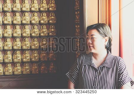 Woman At Wat Boromracha Kanchanapisek Anusorn
