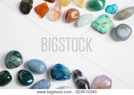 Frame Made With Different Beautiful Gemstones On White Background, Top View. Space For Text