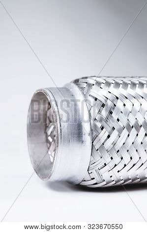 Full-contrast Image Flexible Connection To The Exhaust System Of A Passenger Car On A Gray Gradient 